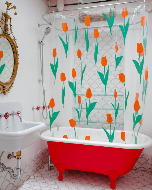 Dusen Dusen Tulip Shower Curtain. Red tulip petals with green stems printed on clear background. Embossed logo in bottom corner. 100% PEVA free of PVC and BPA. 12 anti-rust stainless steel grommets.; A floral shower curtain that WON'T activate your seasonal allergies. <br> Tulips are red-orange in color.