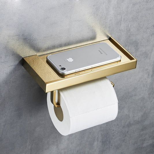 gold brushed toilet paper holder with storage shelf and bathroom accessories